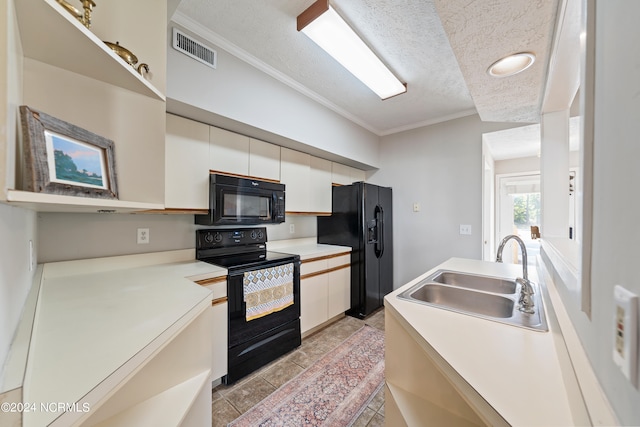 kitchen with black appliances, white cabinetry, sink, and ornamental molding