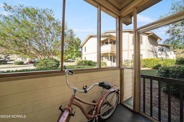 unfurnished sunroom with plenty of natural light