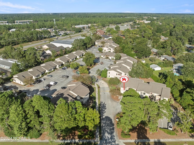 bird's eye view with a forest view and a residential view