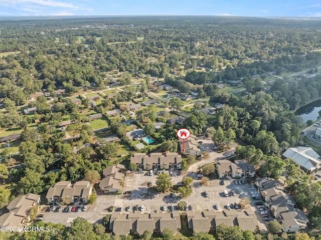 birds eye view of property with a wooded view and a residential view