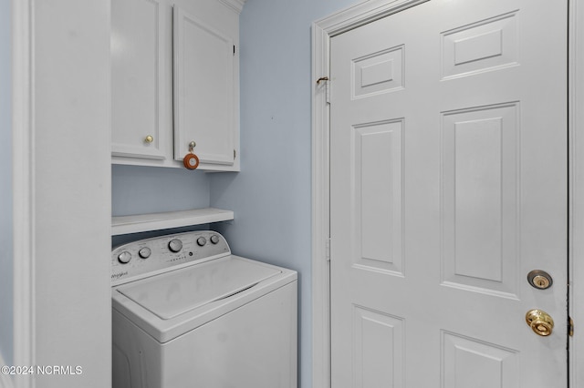 laundry area with cabinets and washer / dryer