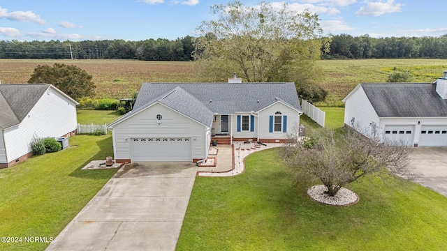 single story home featuring a garage and a front lawn