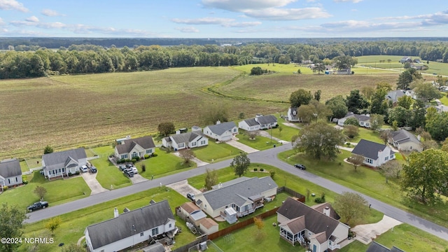 birds eye view of property with a rural view