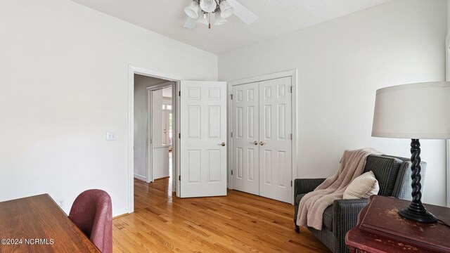 bedroom with hardwood / wood-style flooring, a textured ceiling, and ceiling fan