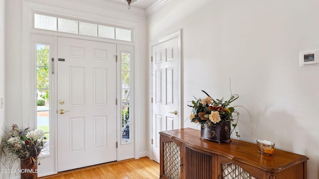 living room featuring ceiling fan, a textured ceiling, and light hardwood / wood-style flooring