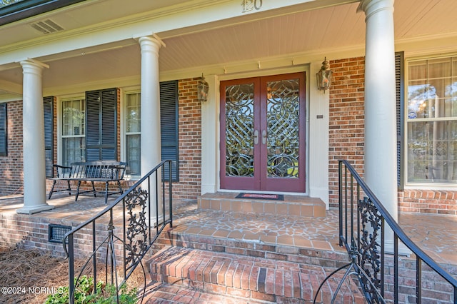 doorway to property featuring covered porch