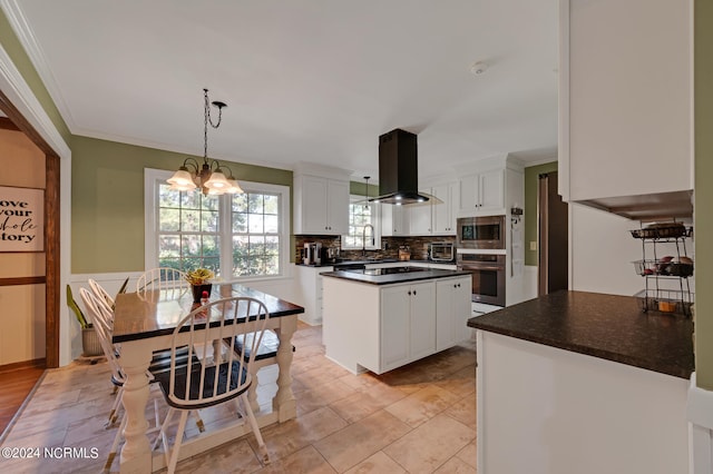 kitchen featuring white cabinets, pendant lighting, island exhaust hood, stainless steel appliances, and a center island