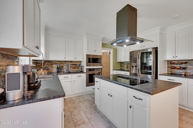 kitchen with decorative backsplash, a center island, stainless steel appliances, island range hood, and white cabinetry