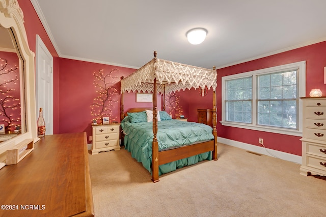 bedroom featuring crown molding and carpet floors