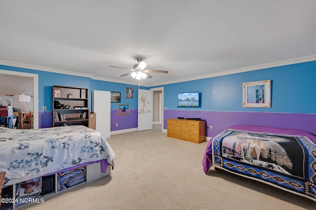 carpeted bedroom with crown molding and ceiling fan