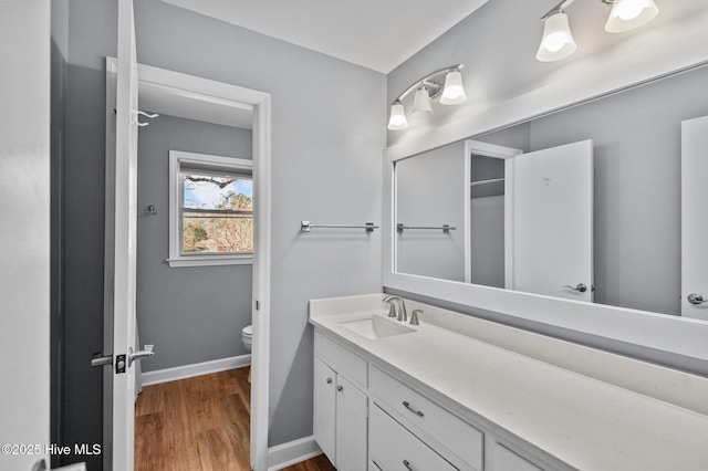 217 Randomwood Ln, River Bend, NC 28562 - bathroom featuring toilet, vanity, wood finished floors, and baseboards
