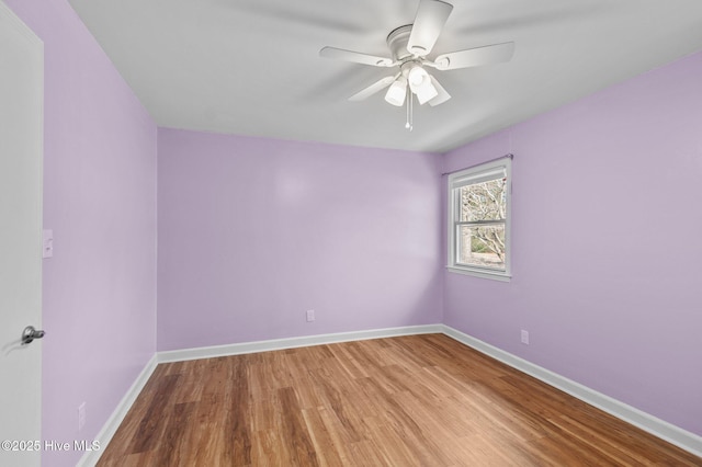 spare room with ceiling fan and light hardwood / wood-style flooring