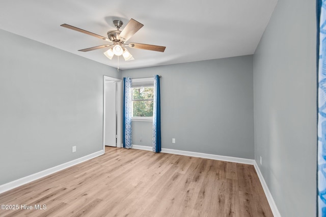 spare room featuring ceiling fan and light hardwood / wood-style floors