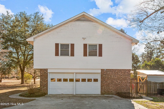 view of side of home featuring a garage