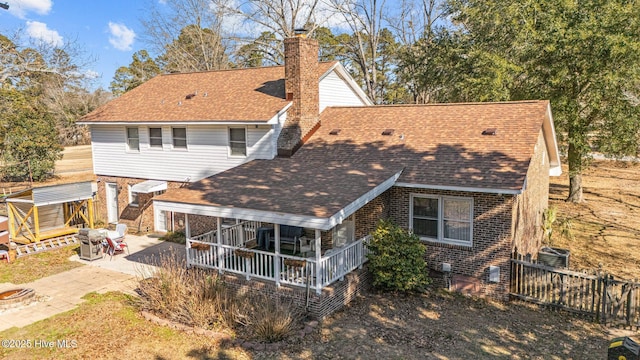 rear view of property featuring a patio