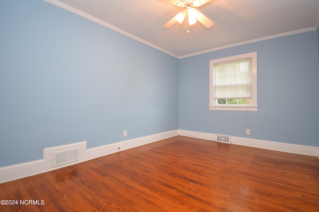 spare room featuring ornamental molding, wood-type flooring, and ceiling fan