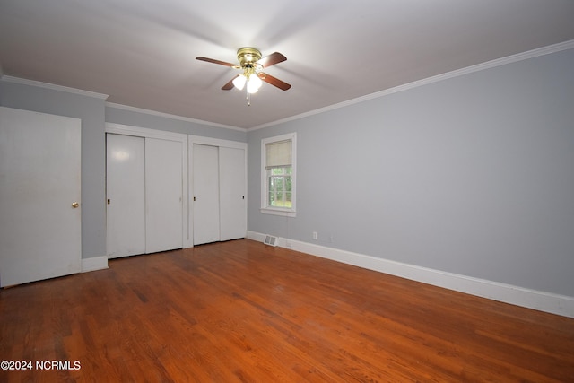 unfurnished bedroom featuring wood-type flooring, ceiling fan, and crown molding