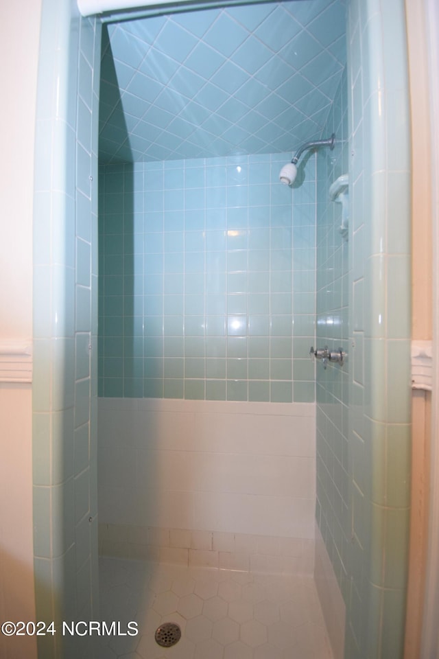 bathroom with a tile shower