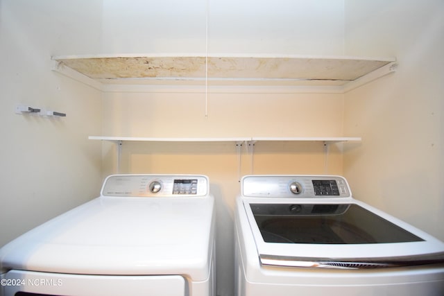 washroom with washing machine and clothes dryer