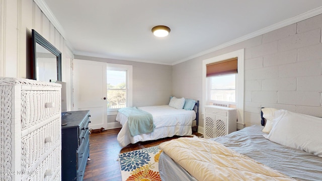 bedroom with multiple windows, dark wood-type flooring, and crown molding