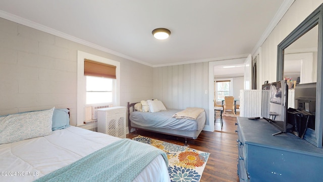 bedroom featuring cooling unit, ornamental molding, dark wood-type flooring, and multiple windows