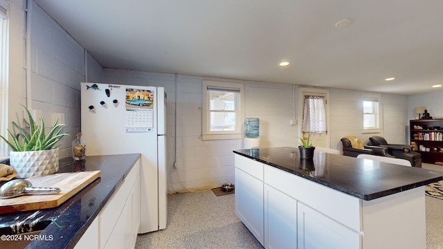 kitchen with white cabinets and white refrigerator