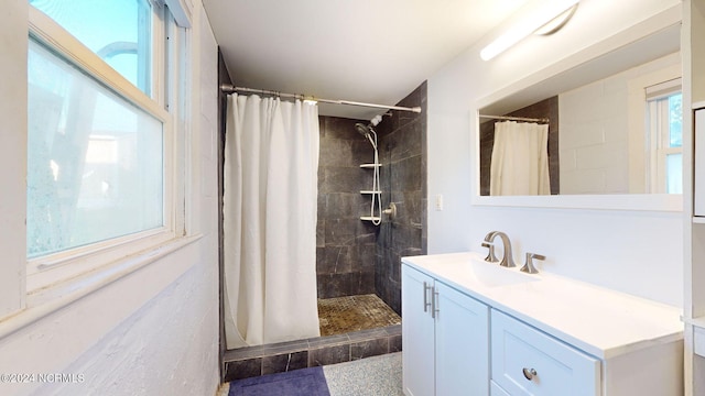 bathroom featuring a shower with shower curtain and vanity