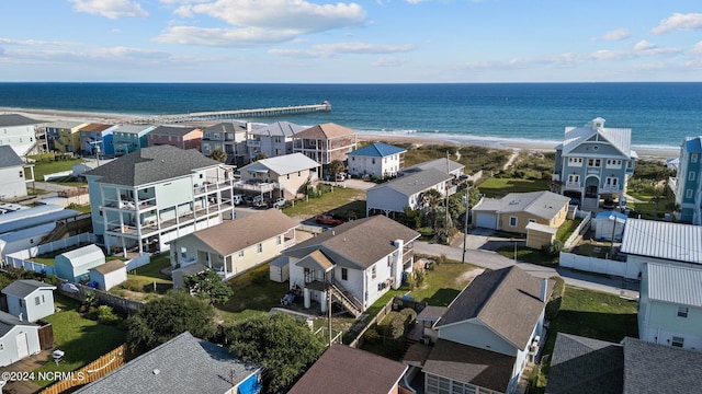 birds eye view of property featuring a water view and a view of the beach