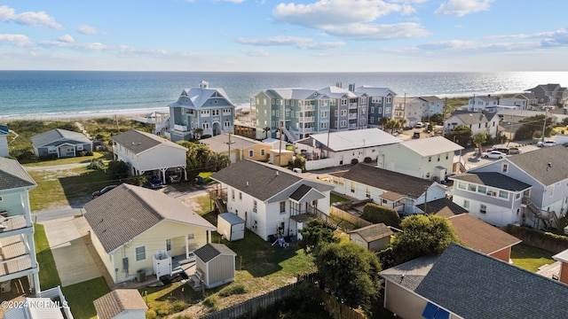 birds eye view of property with a view of the beach and a water view