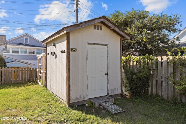 view of outbuilding featuring a yard