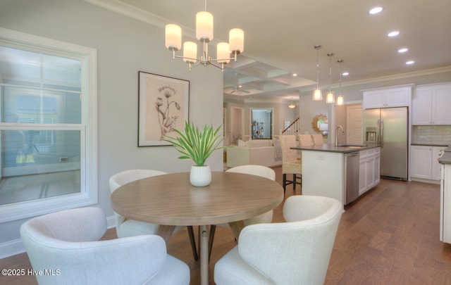 572 Hearthside Dr SE, Bolivia, NC 28422 - dining space with recessed lighting, ornamental molding, coffered ceiling, dark wood finished floors, and stairway