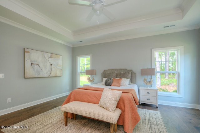 572 Hearthside Dr SE, Bolivia, NC 28422 - bedroom featuring a raised ceiling, crown molding, wood finished floors, baseboards, and a ceiling fan