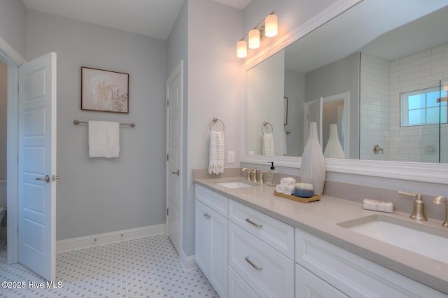 572 Hearthside Dr SE, Bolivia, NC 28422 - full bathroom featuring tile patterned floors, double vanity, a tile shower, and baseboards