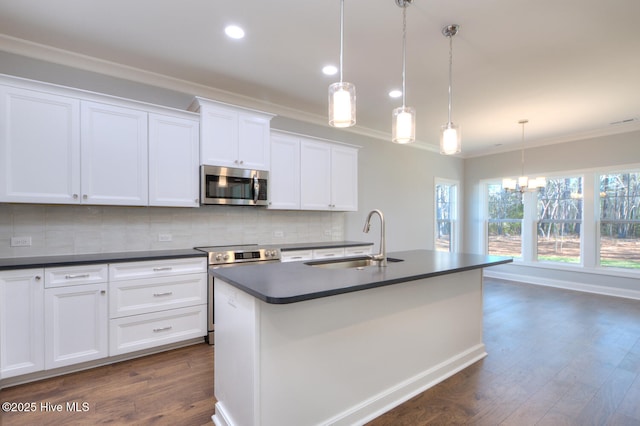 572 Hearthside Dr SE, Bolivia, NC 28422 - kitchen featuring stainless steel appliances, a sink, dark countertops, crown molding, and tasteful backsplash