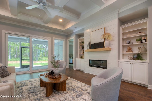 572 Hearthside Dr SE, Bolivia, NC 28422 - living area featuring crown molding, ceiling fan, a glass covered fireplace, coffered ceiling, and built in features
