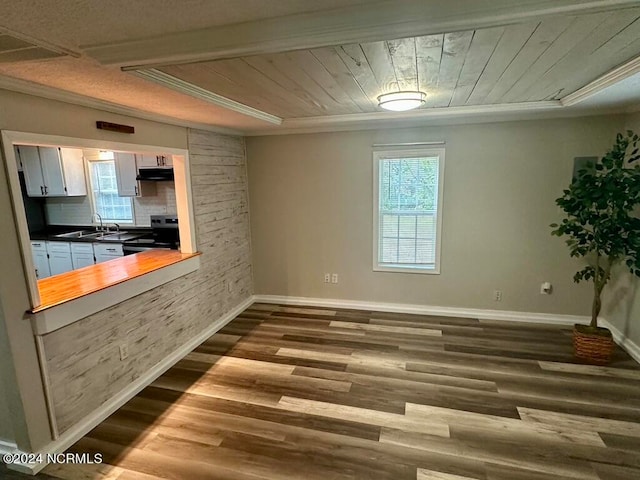 kitchen with white cabinets, sink, hardwood / wood-style flooring, electric range, and wooden ceiling