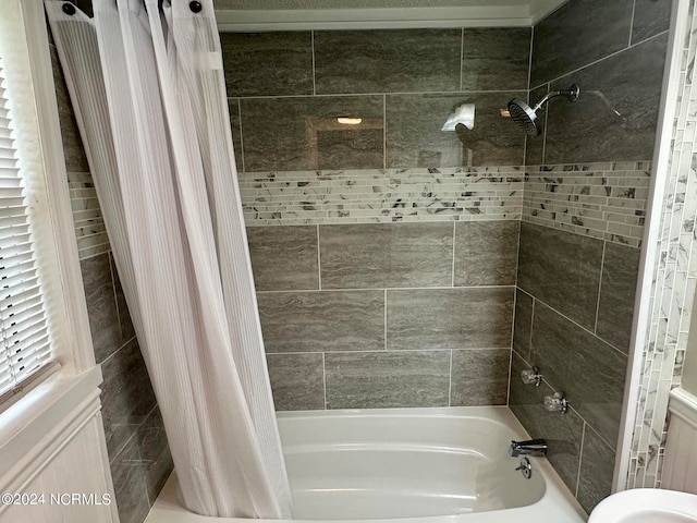 bathroom featuring shower / bathtub combination with curtain