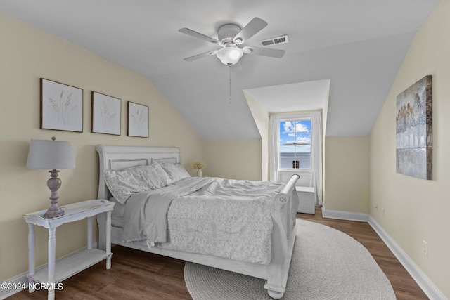 bedroom featuring ceiling fan, baseboards, lofted ceiling, dark wood-style flooring, and visible vents