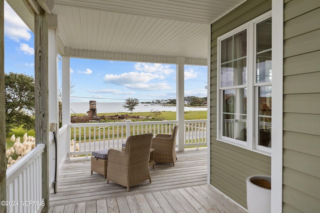 wooden terrace with a water view