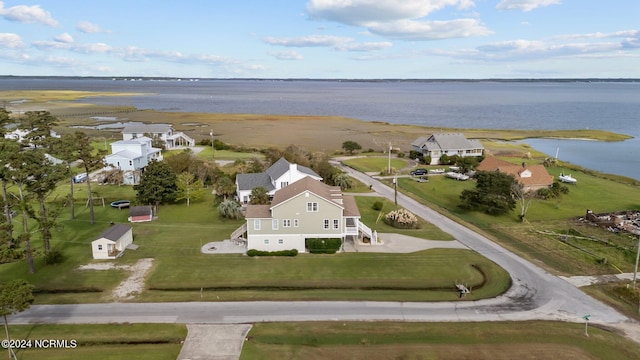 bird's eye view featuring a water view and a residential view