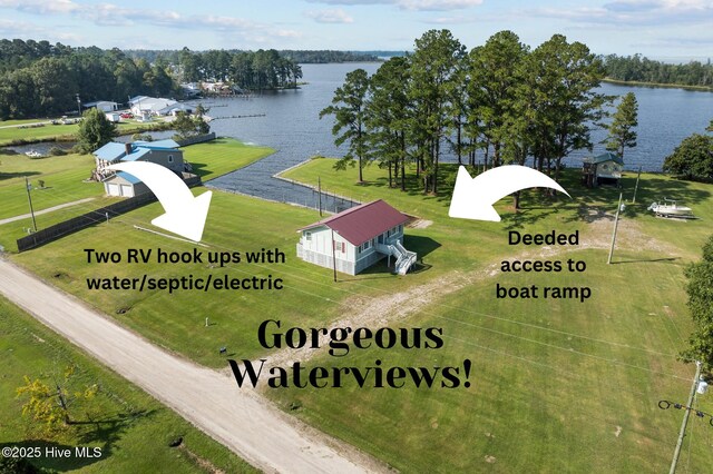 birds eye view of property with a water view