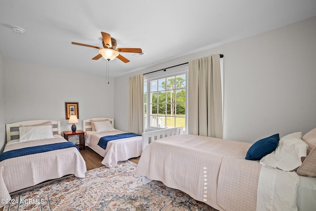 bedroom featuring wood-type flooring and ceiling fan