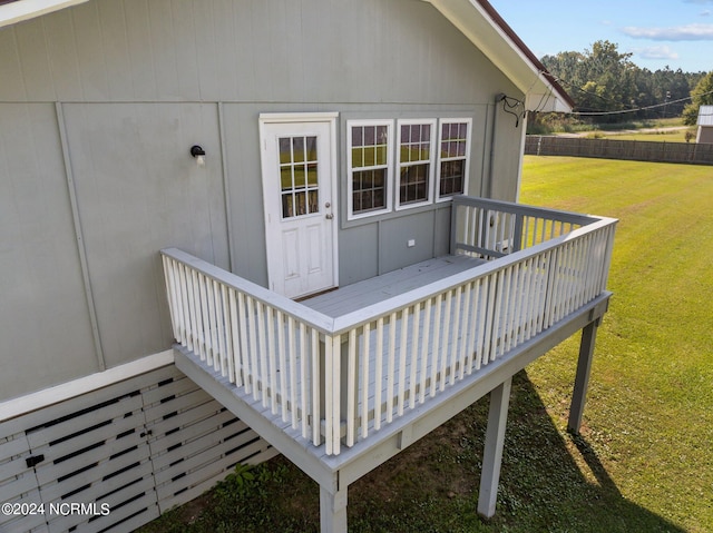 wooden terrace with a lawn