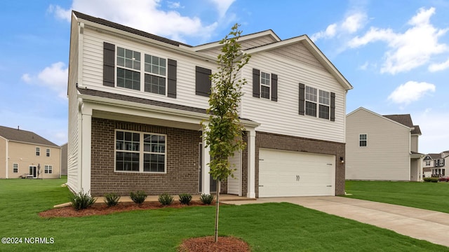 view of front of home featuring a garage and a front lawn