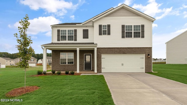 view of front of house with a garage and a front lawn