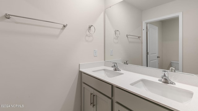 bathroom with vanity and toilet