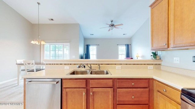 kitchen with a sink, a healthy amount of sunlight, light countertops, and stainless steel dishwasher