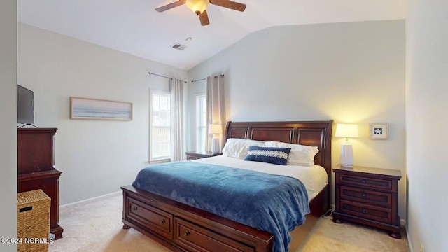 bedroom featuring lofted ceiling, ceiling fan, light colored carpet, visible vents, and baseboards