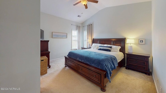 bedroom with lofted ceiling, ceiling fan, light colored carpet, visible vents, and baseboards