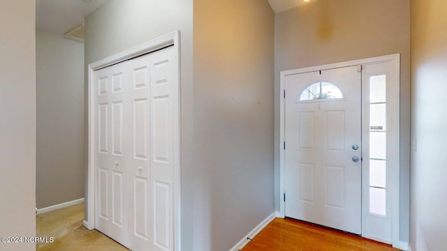 entrance foyer featuring light wood finished floors and baseboards